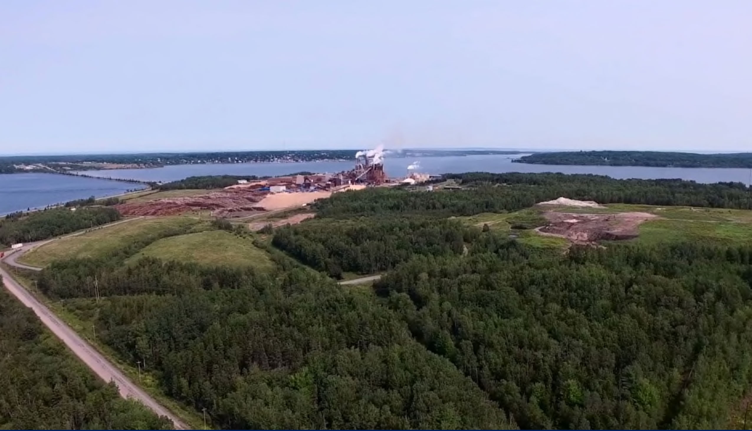 The Northern Pulp mill sits in the distance.