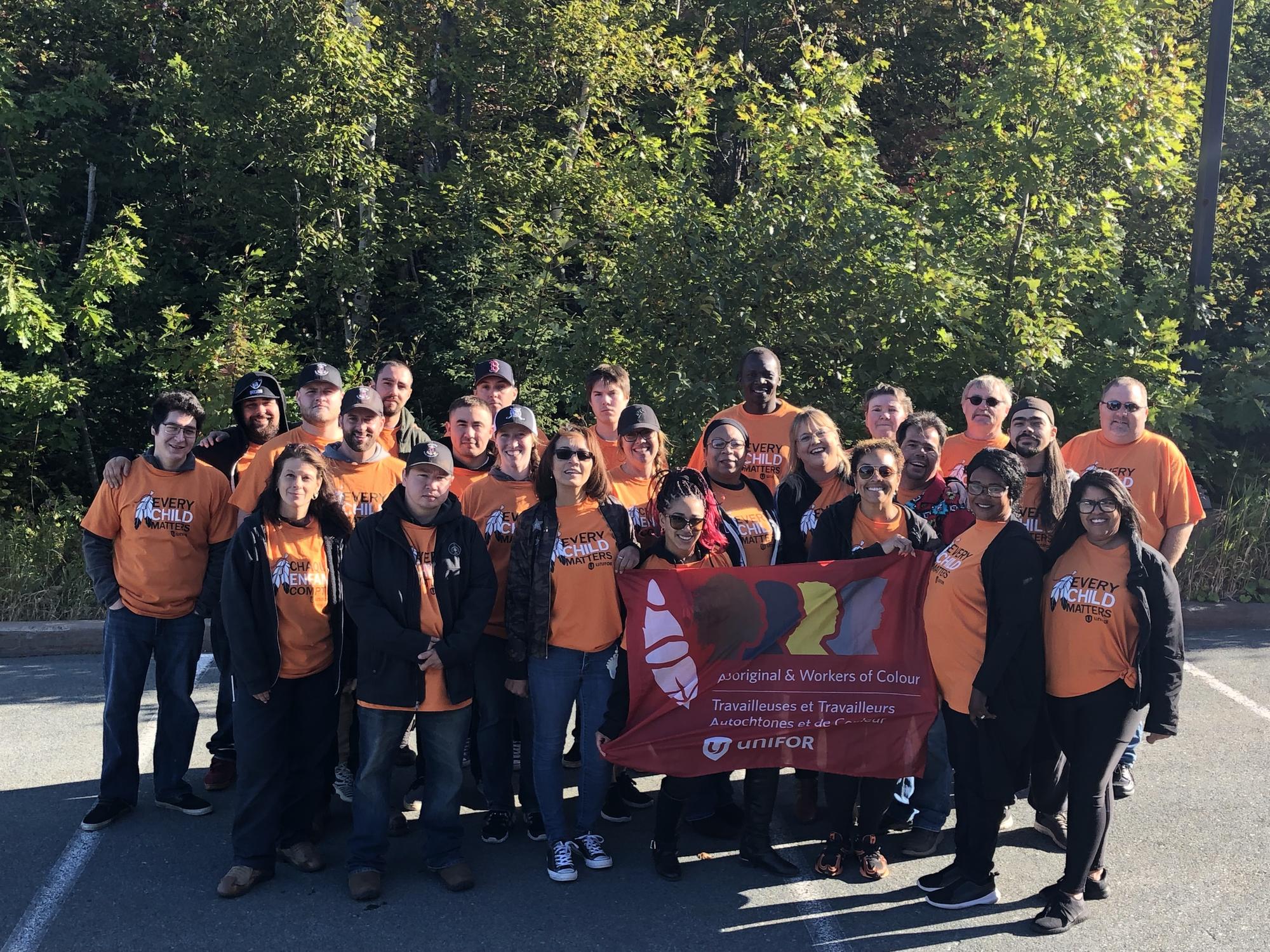 AWOC group pic everyone is wearing orange "Every Child Matters" t-shirts