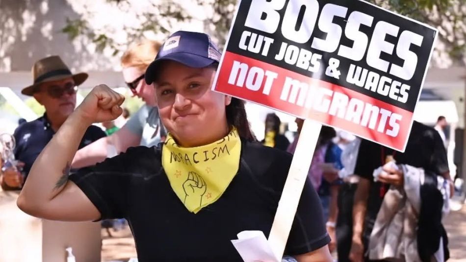 A Woman holding a sign 