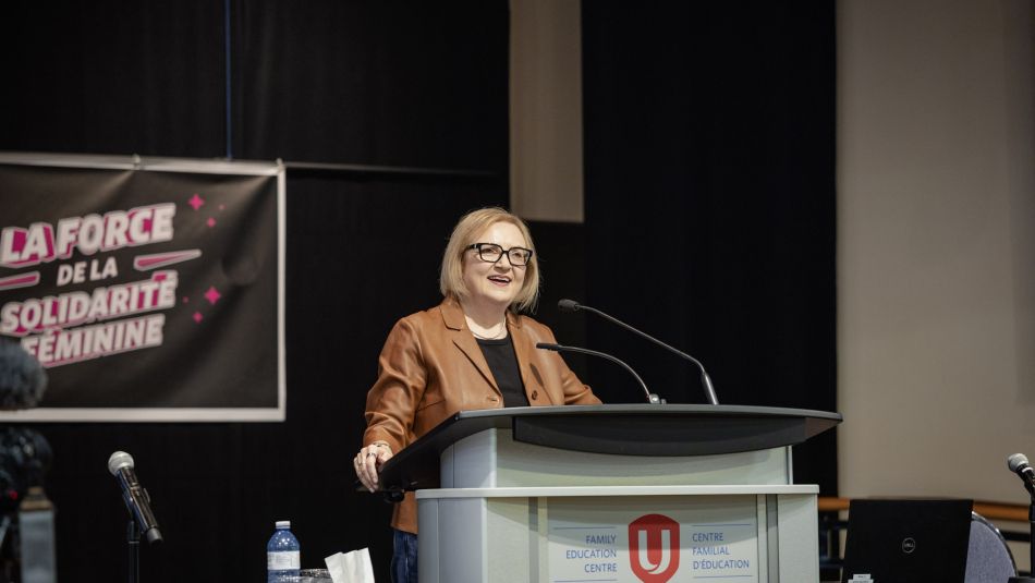 A women speaking at a podium