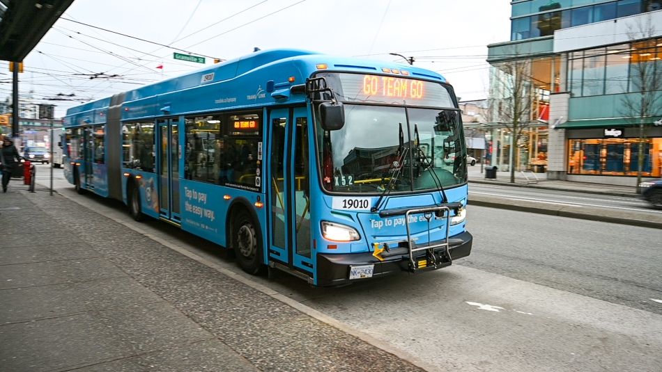 Bus stopped at curb on Broadway Avenue in Vancouver.