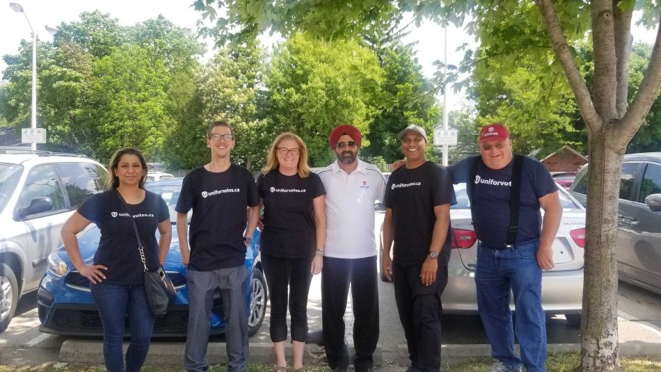 Unifor member organizers pose with Naureen Rizvi.