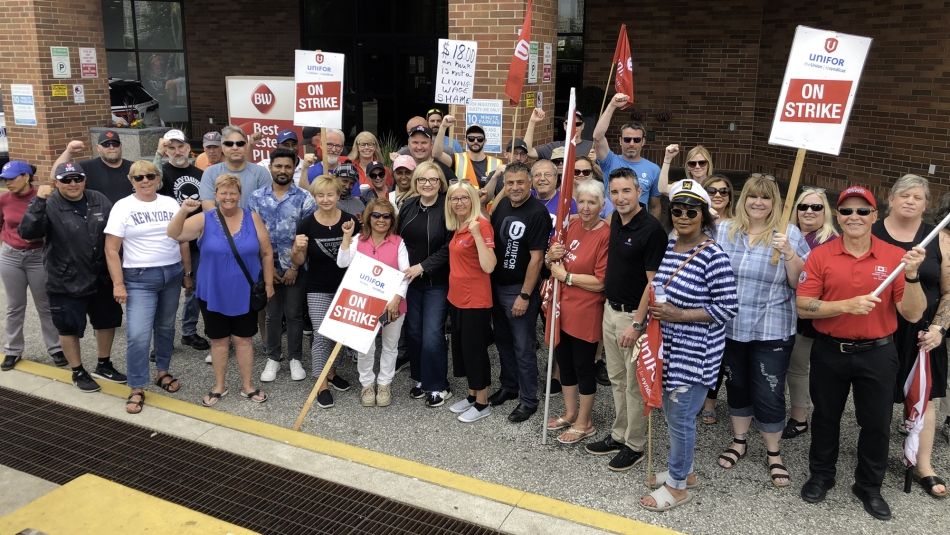 Large group of picketers posing for a photo