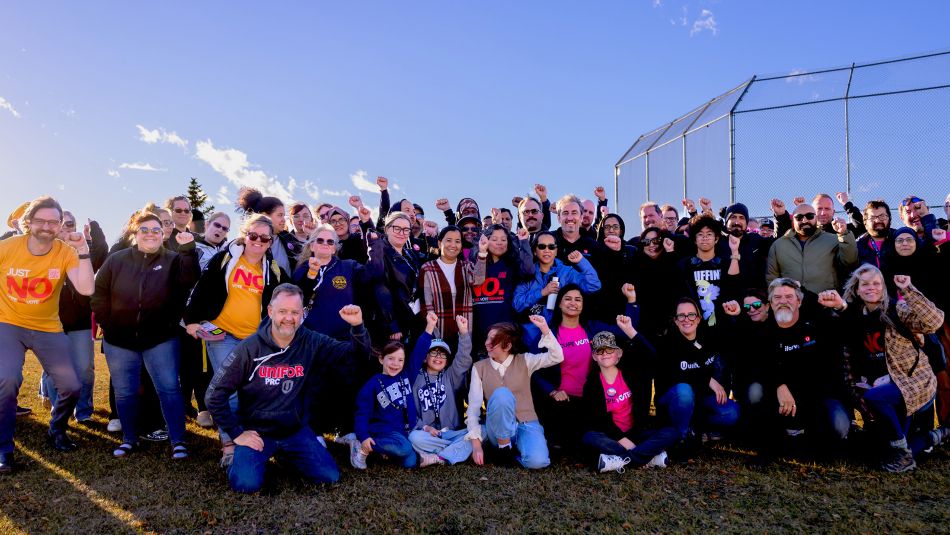 A large group outside with a blue sky