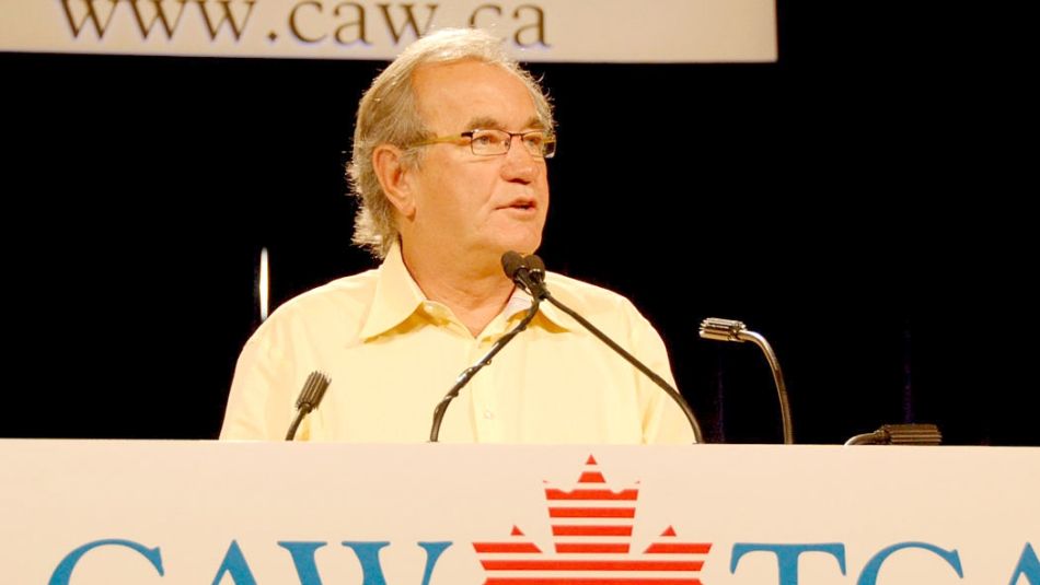 Buzz Hargrove standing at a podium