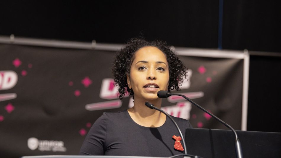 A women at a podium speaking 