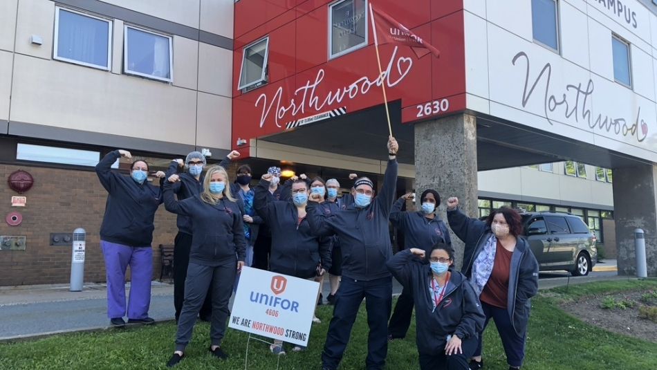 Members of Unifor Local 4606 gathered in front of Norhtwood long-term care home.