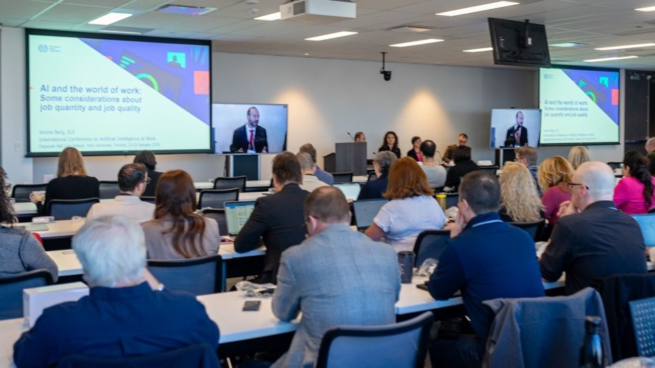 A conference room including participants of the AI at Work conference.