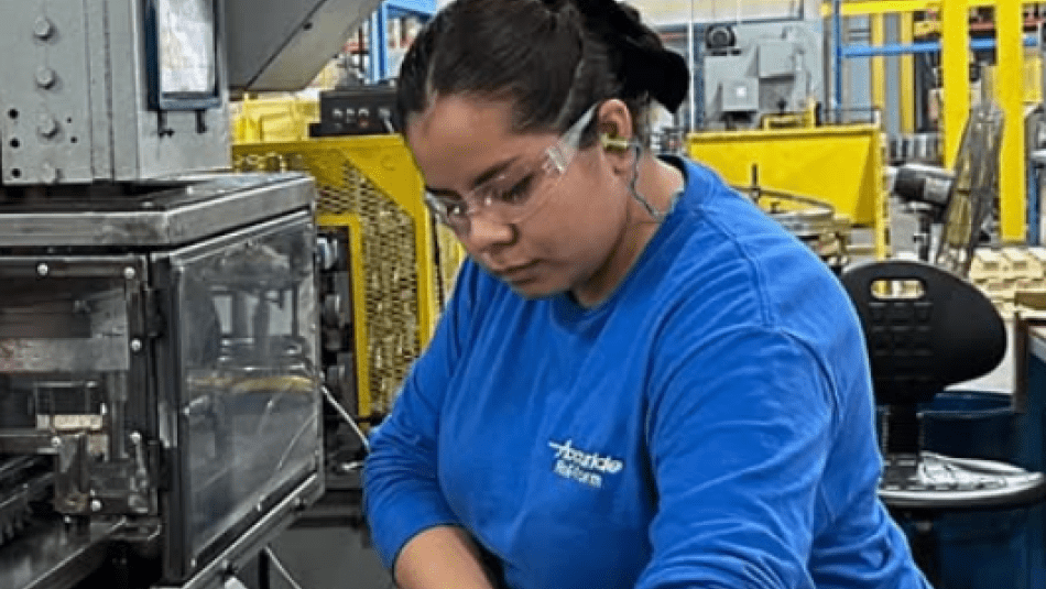 Accuride Employee a women in blue gloves working 