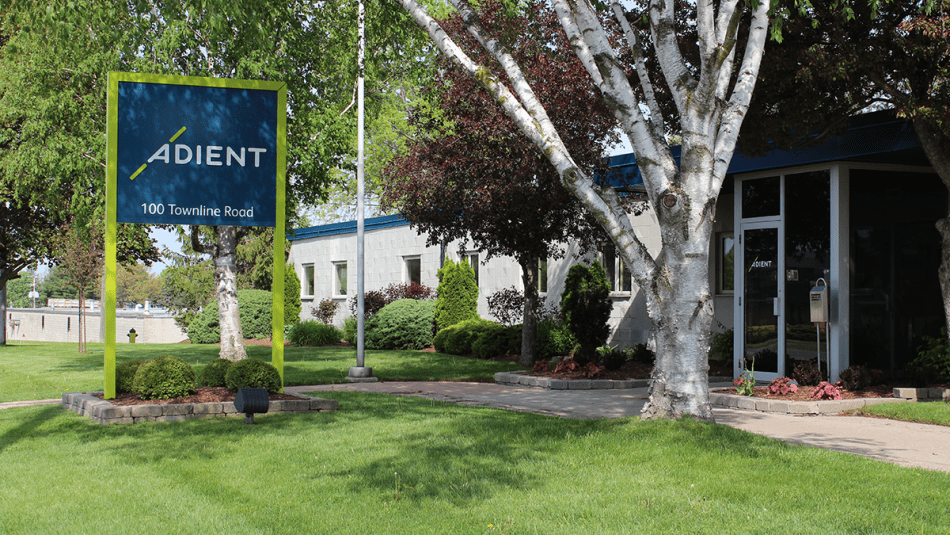 Adient sign outside the exterior of the plant.