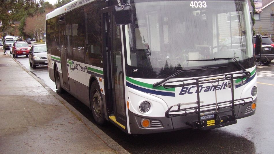 Front view of a BC Transit bus parked at the curb
