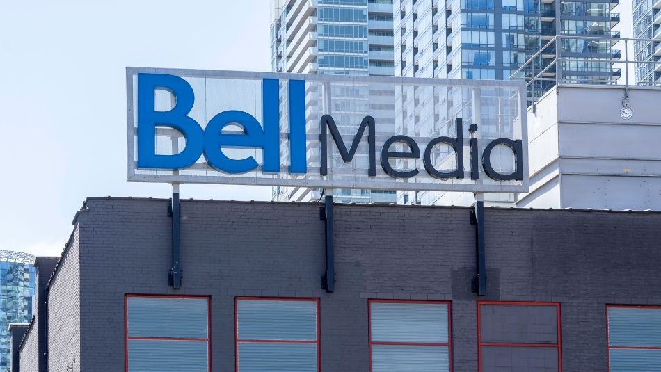 A blue Bell Media sign atop a building.