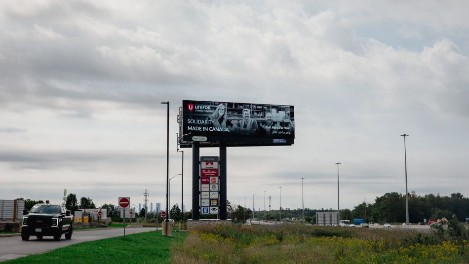 A billboard that reads: Unifor - Solidarity. Made in Canada.