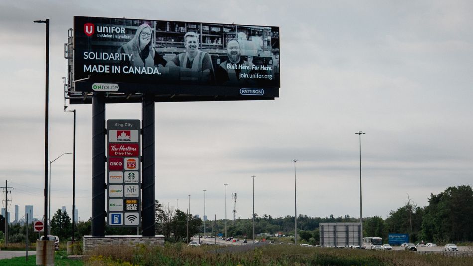 A billboard that reads: Unifor - Solidarity. Made in Canada.