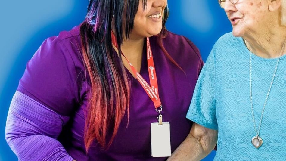 Close-up of a CCA supporting a long-term care resident.