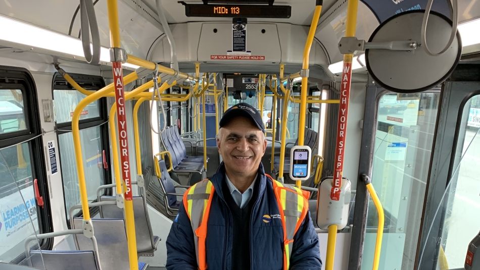 Charanjit Parhar in his transit operator's uniform on a bus