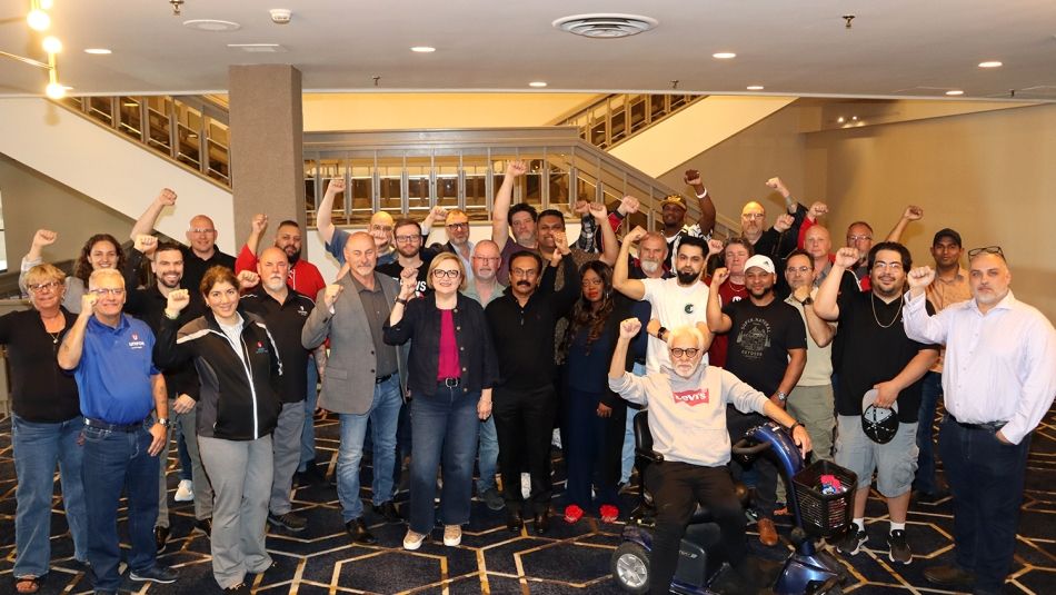 Group of people with arms up