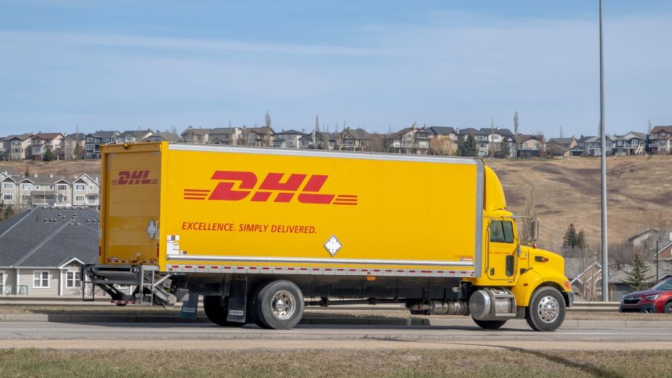 A DHL semi truck in a suburban area