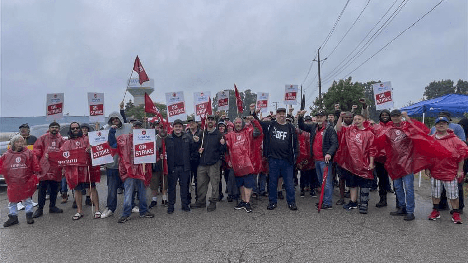 Unifor members stand on the picket line at Dajcor