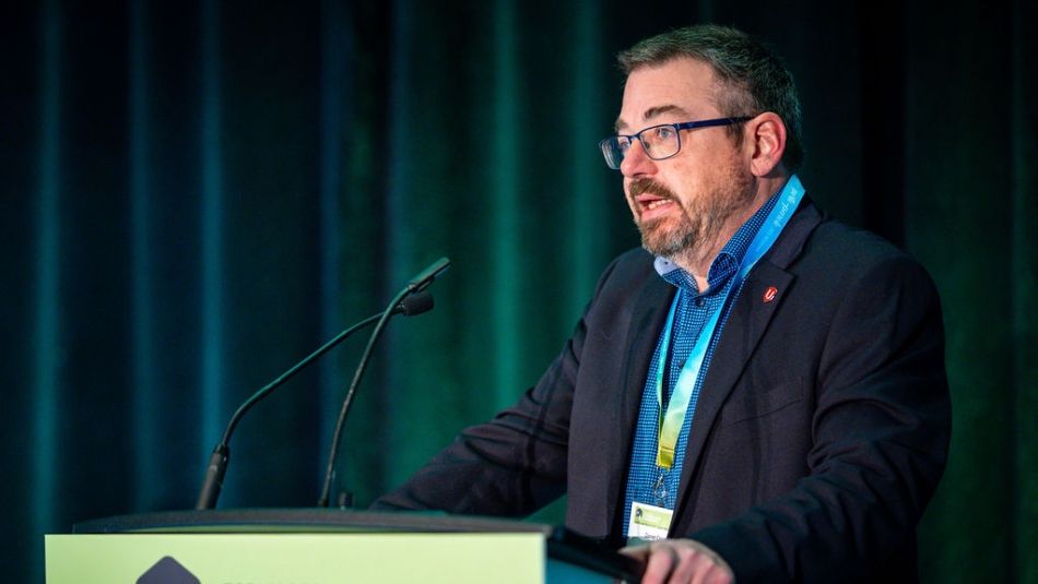 A man speaking at a podium