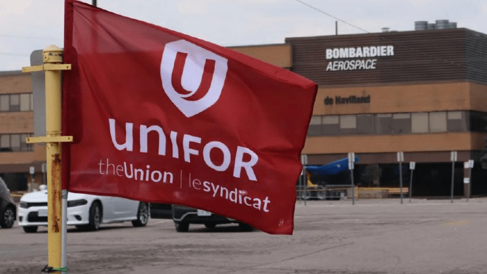 Red Unifor Flag flying outside of the De Havilland plant at Downsview in Toronto.