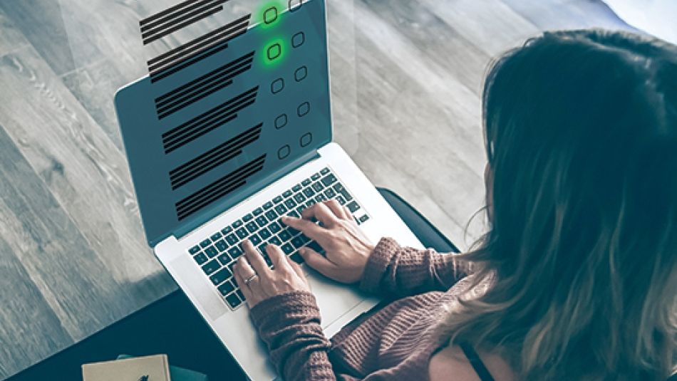 a women typing on a laptop