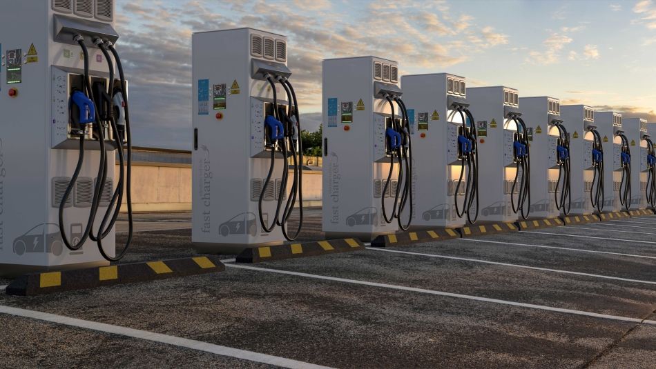 Electric charging stations in a row at dusk