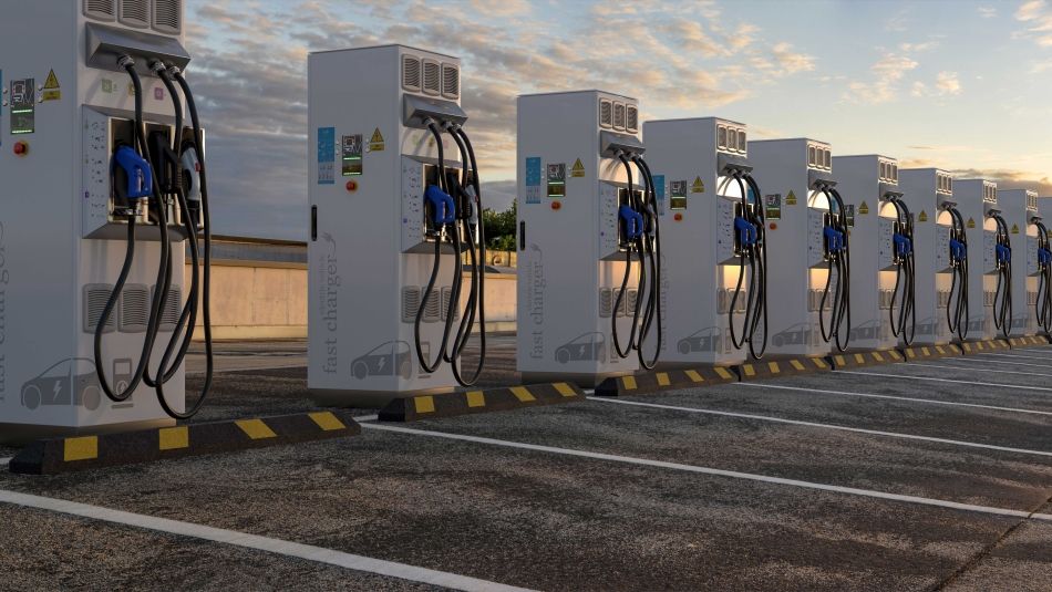 EV stations in a parking lot at dusk