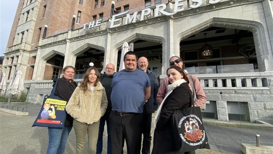 Five people outside of the Empress Hotel