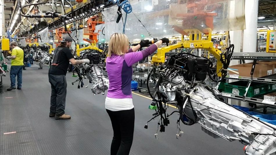 Members working on the line in an auto factory.