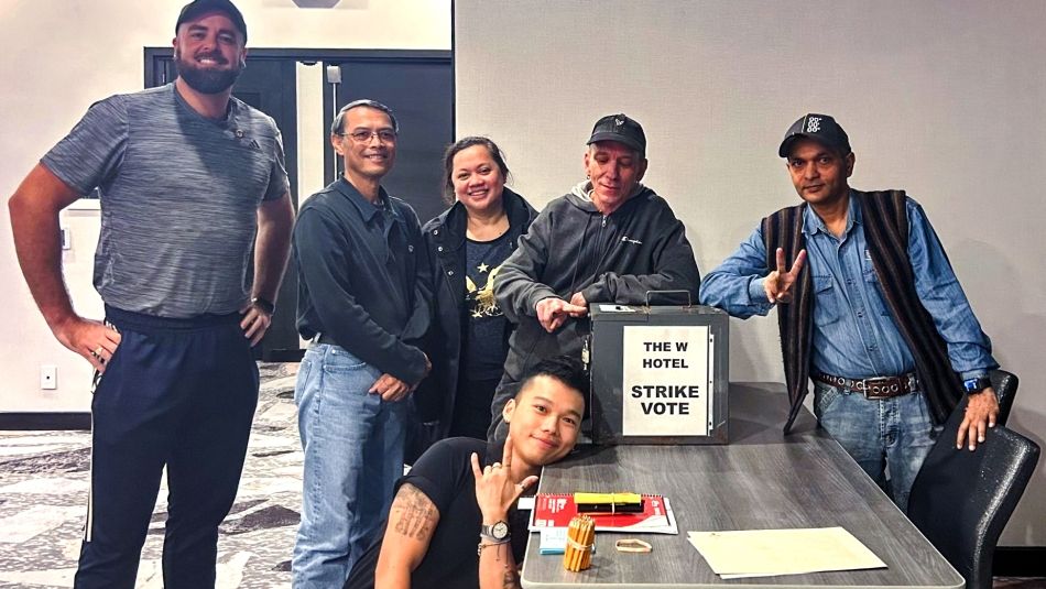 Six Unifor members posing with a ballot box.