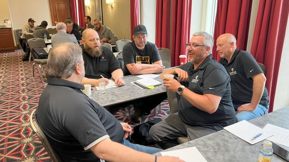 Five men sitting discussion at a Gatineau BWP meeting