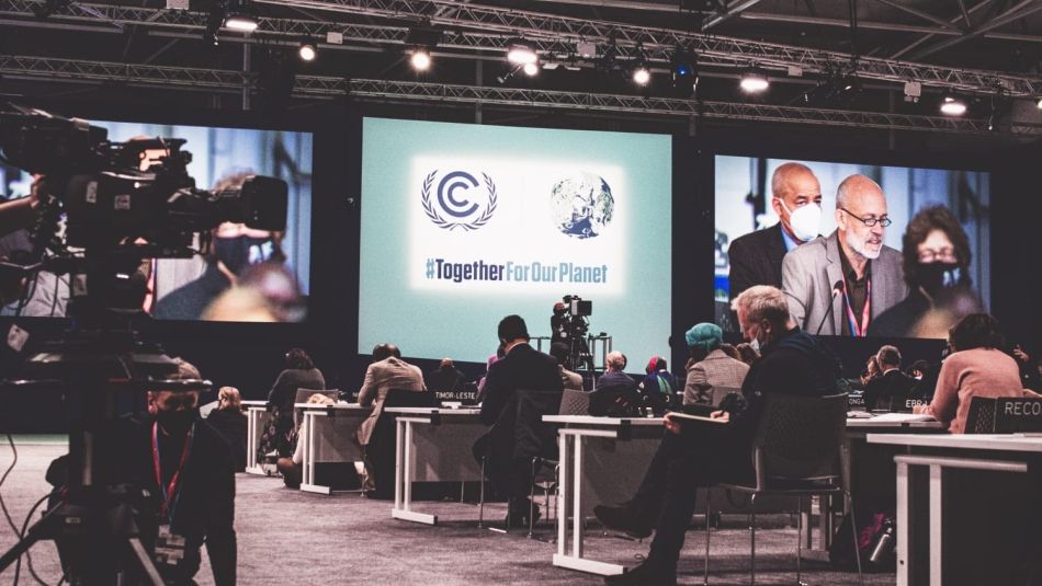 Delegates attend a presentation during COP26.