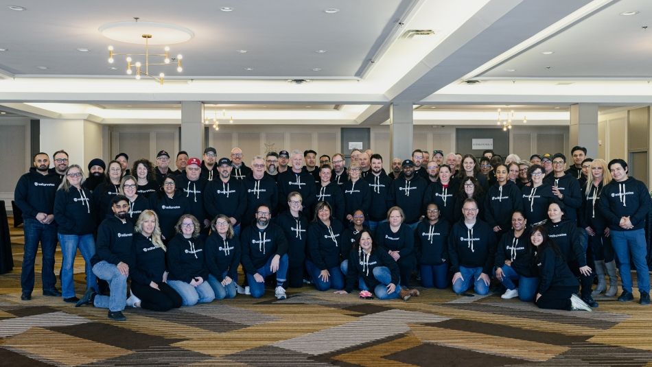 A large group photo people wearing Unifor votes hoodies