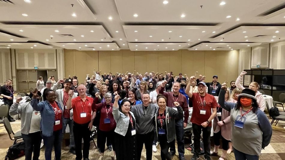 A group of people with their fists up.