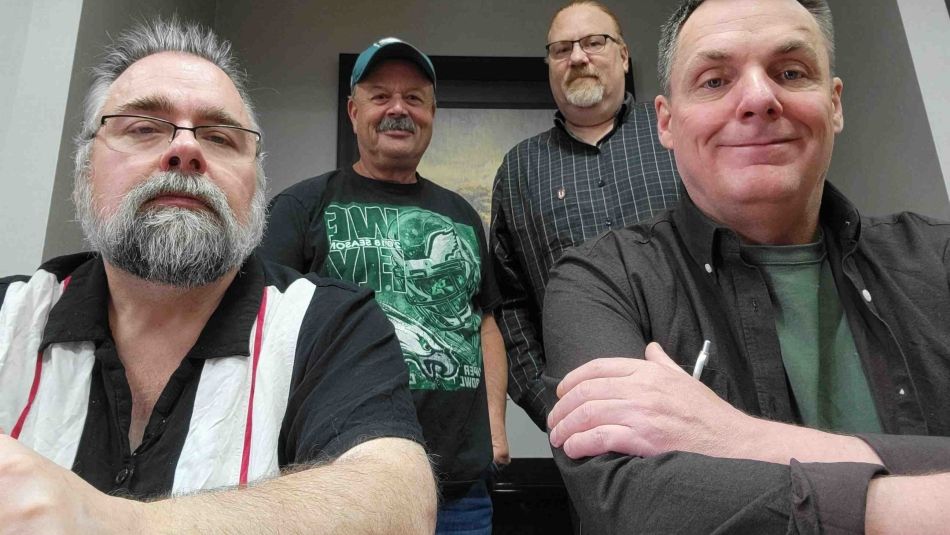 Four men from Unifor Local 1917 bargaining committee