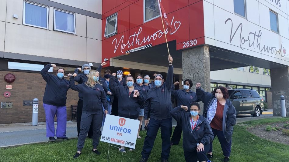 A group of health care workers outside Northwood centre wearing face masks