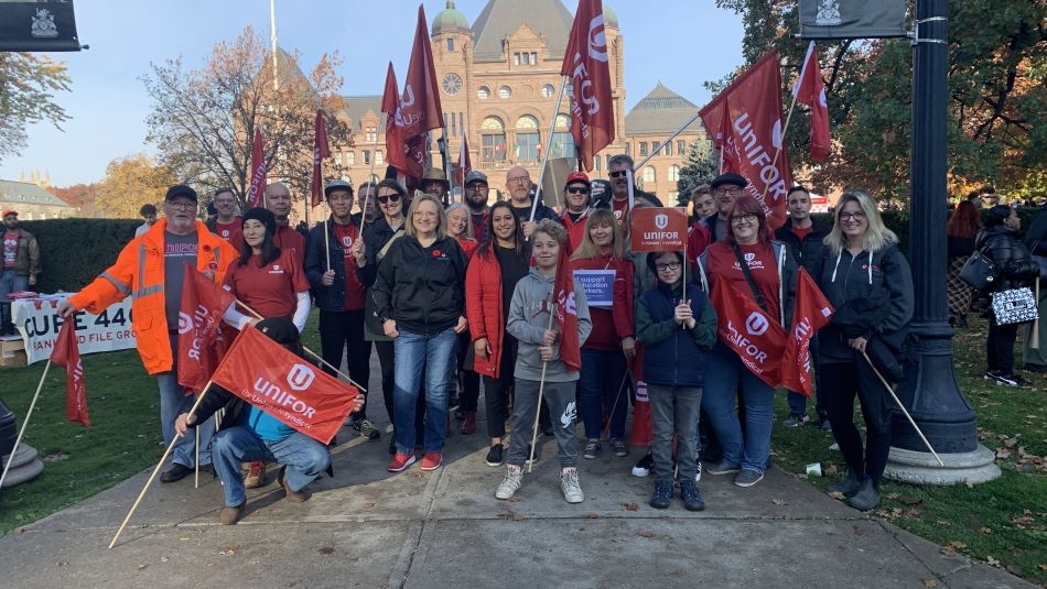 Unifor leadership and members picketing on behalf of CUPE member at Queen's Park