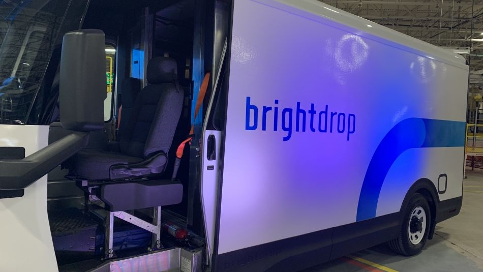 Brightdrop truck inside a shop with florsecnt lights