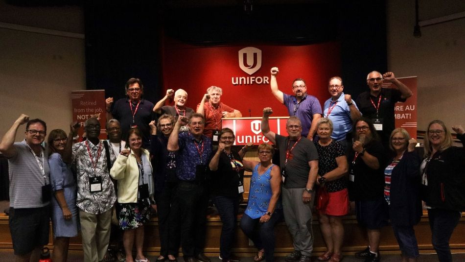 A group of people raising their fists in the air