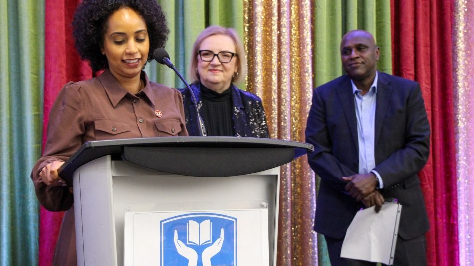 Samia Hashi speaks at a podium