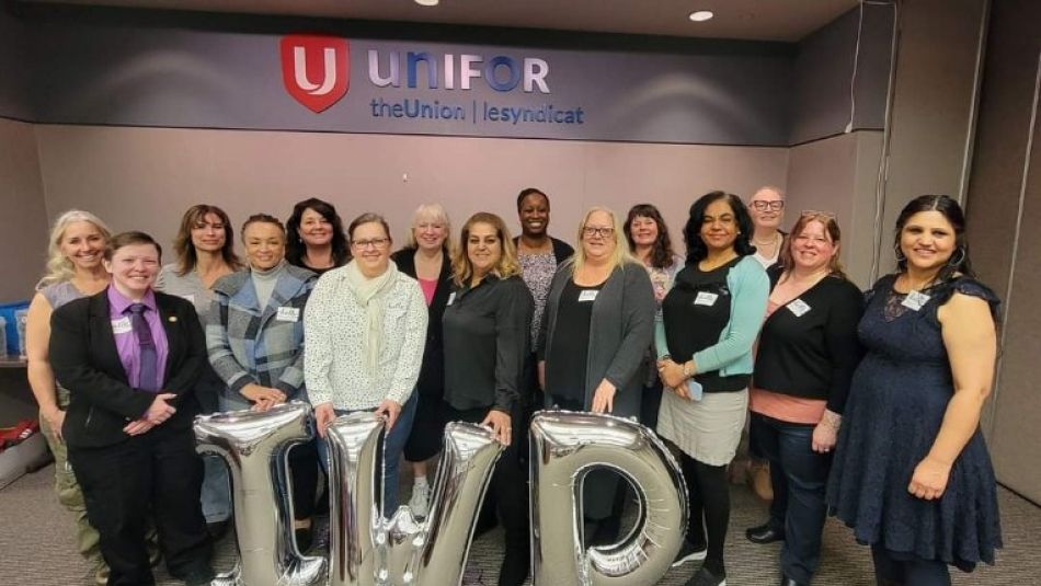 A group of Unifor sisters posed behind IWD ballons.