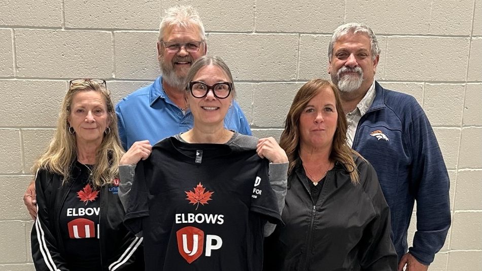Five people two wearing elbows up shirts