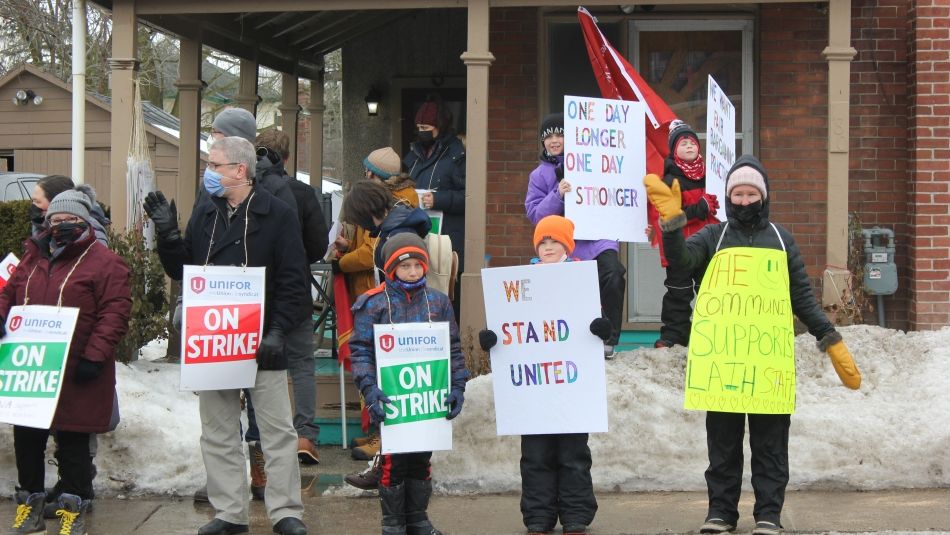 Members on the picket line holding on stike signs at Napanee’s Lennox and Addington Interval House