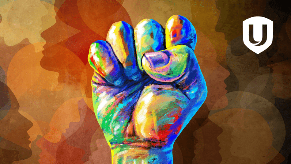 An artistic backgroud of profiles and a splotted coloured fist raised.