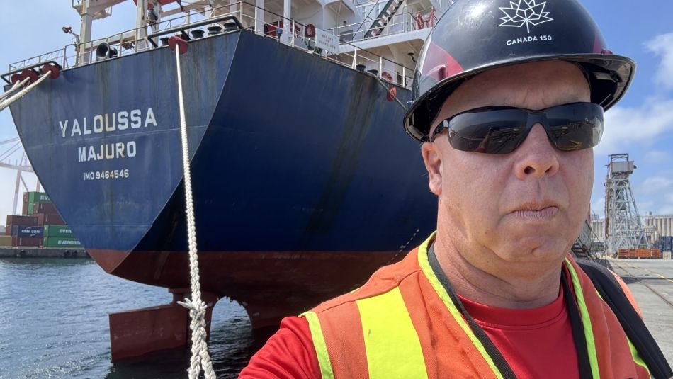 ITF Coordinator (Canada) Karl Risser stands in front of a ship docked at the port of Halifax