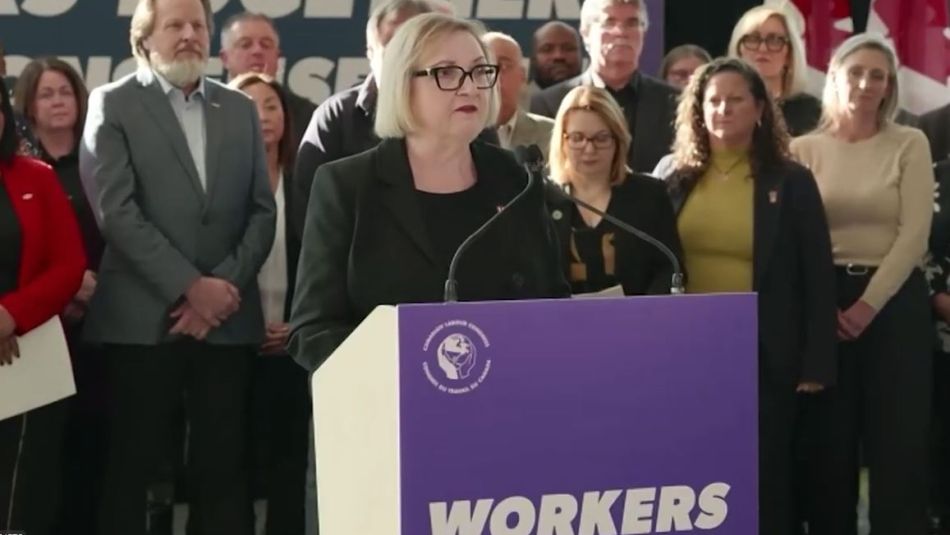 A women speaks at a podium