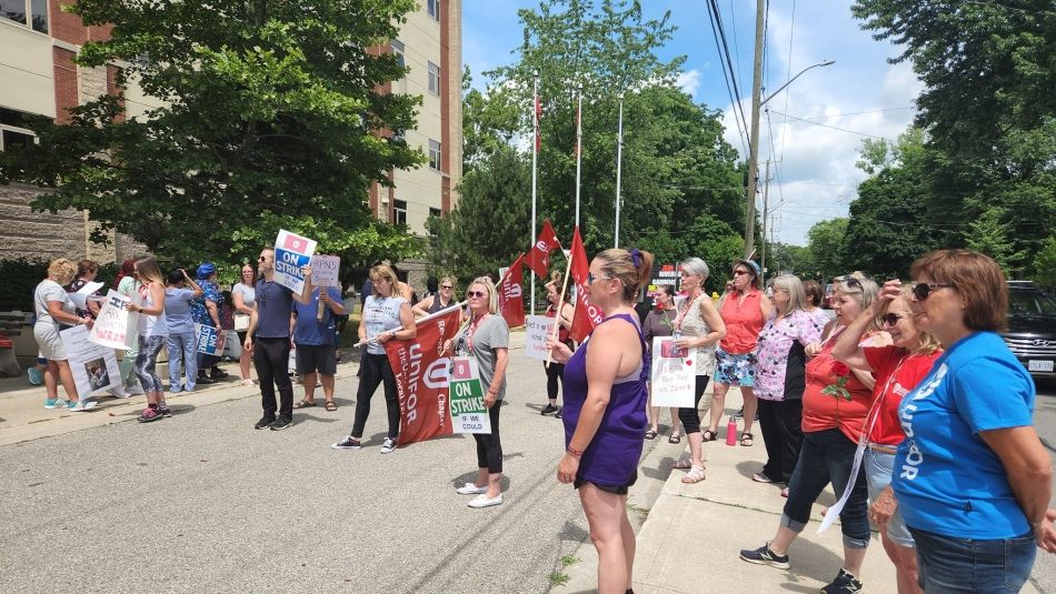 Unifor members in Chatham, Ontario picketing outside Riverview Gardens. Many hold signs reading "On strike if we could."