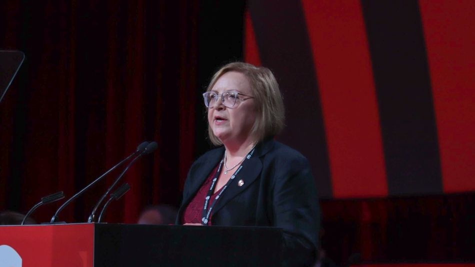 Lana Payne, National Secretary-Treasurer Lana Payne stands at the Convention podium speaking to delegates