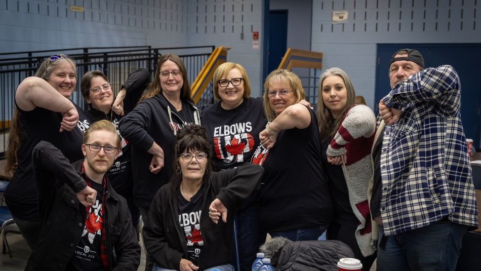 A group of people with their elbows up